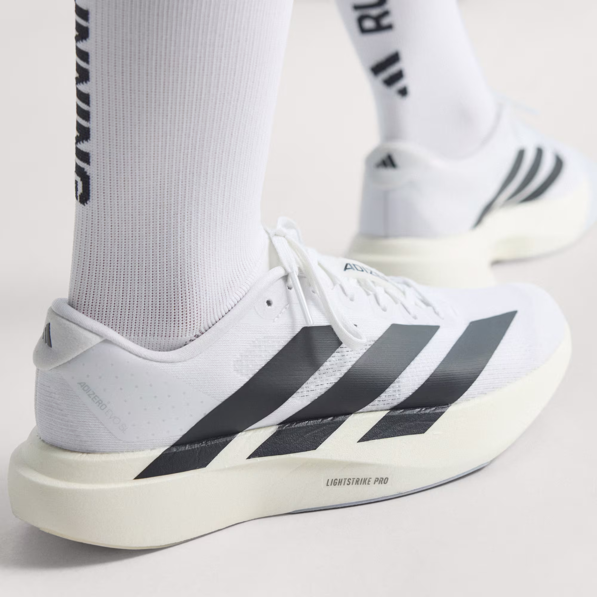 Zapatilla_Adizero_EVO_SL_Blanco_JH6208_HM9